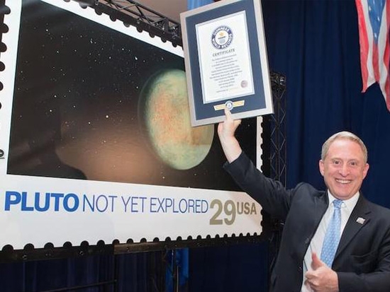 US postal service creates history; earns Guinness tag for sending postage stamp to Pluto